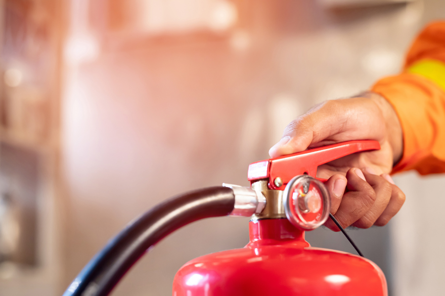 Person learning how to use a fire extinguisher through an online interactive training module