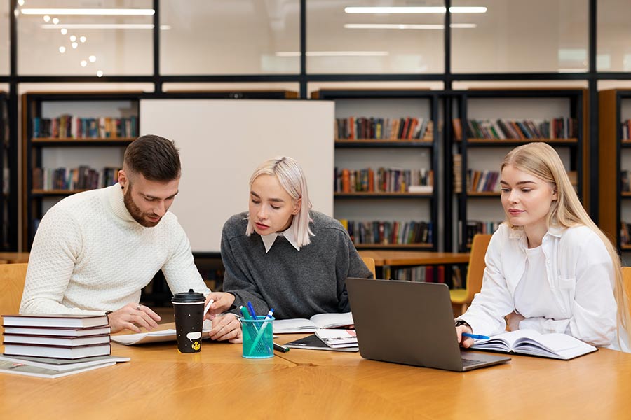 People studying Basic First Aid Training on a laptop